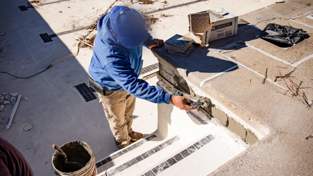 man renovating pool